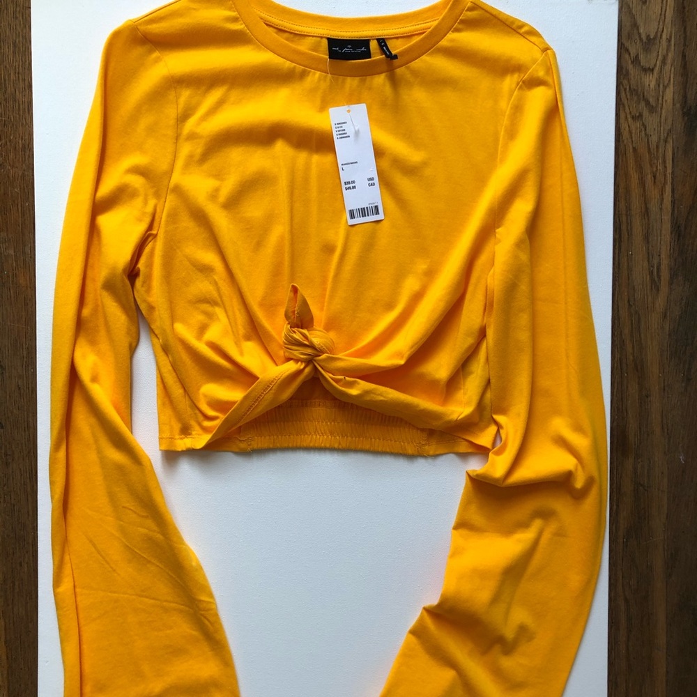 Out from under knotted long flare sleeves crop top
